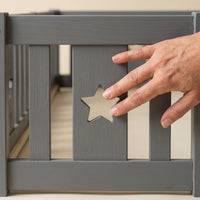 Montessori double bed for floor mounting with star-shaped side rails