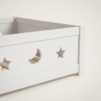 Montessori floor bed with moon and star motif