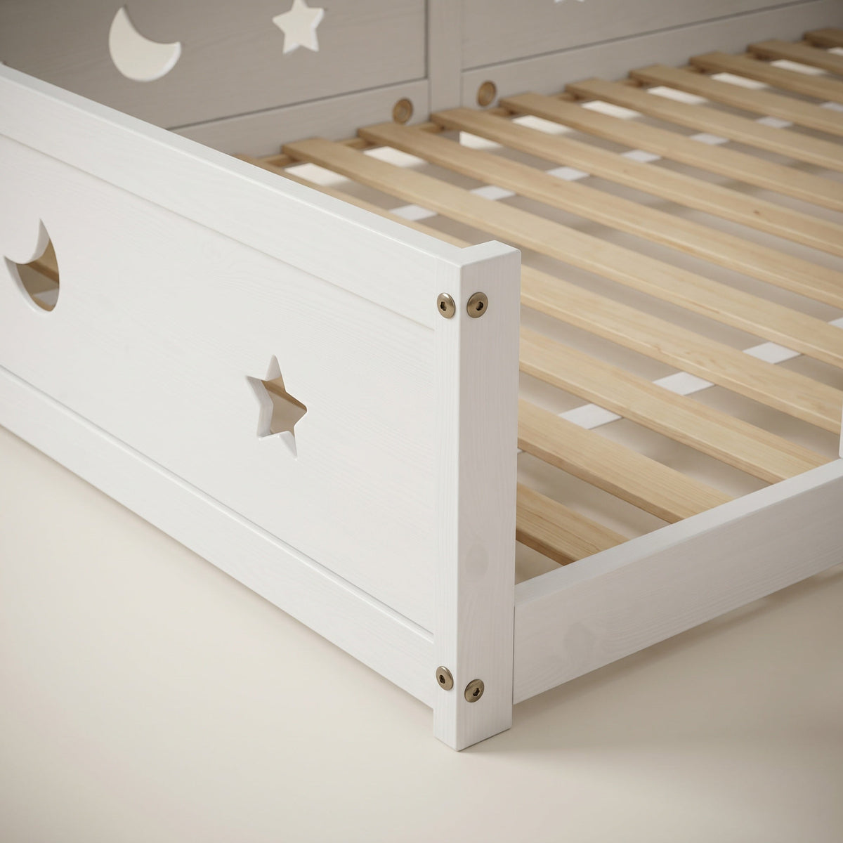 Montessori floor bed with moon and star motif