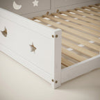 Montessori floor bed with moon and star motif