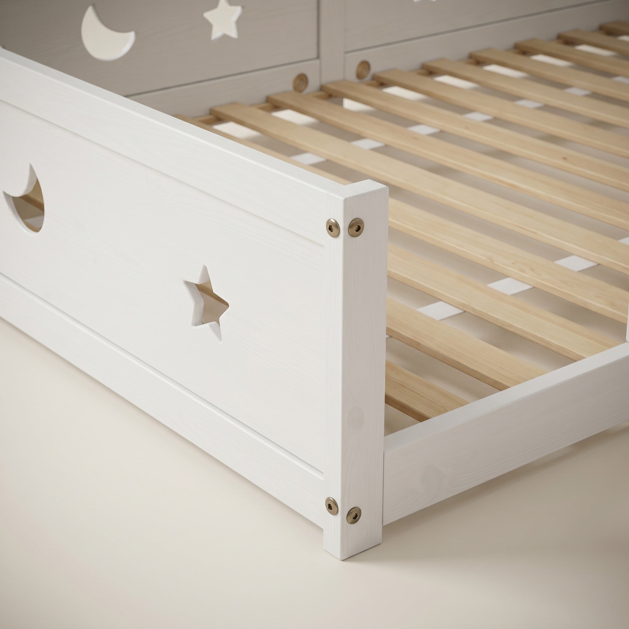 Montessori floor bed with moon and star motif