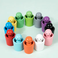 Montessori toys: dolls and colorful shapes