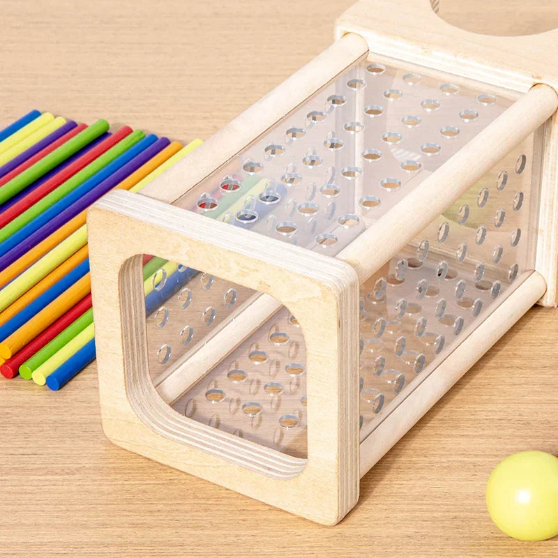 Montessori tower with balls and colorful sticks