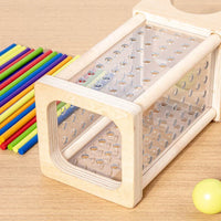 Montessori tower with balls and colorful sticks