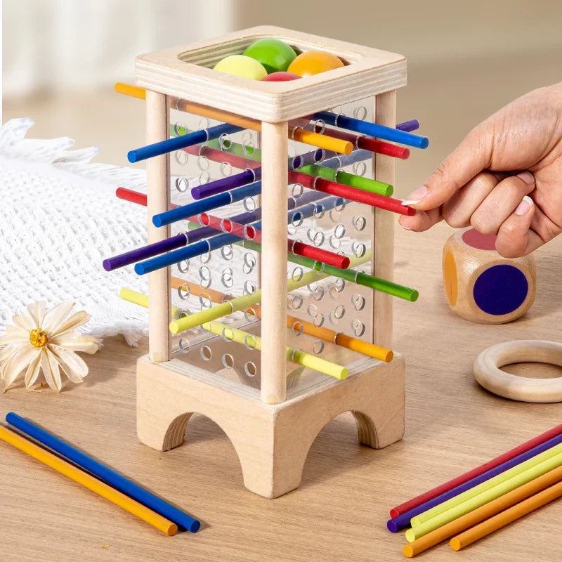 Montessori tower with balls and colorful sticks