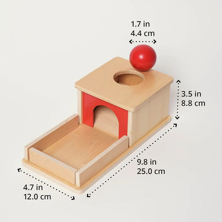 Montessori box on the topic of object permanence