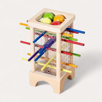 Montessori tower with balls and colorful sticks